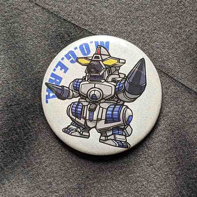 リフレクター缶バッチ　M.O.G.E.R.A.